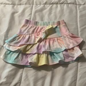 Multicolored ruffle skirt with shorts underneath.